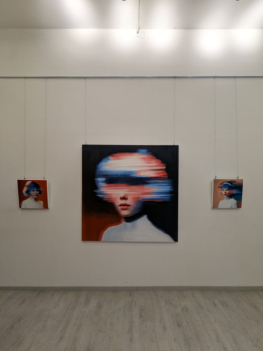 Nuclear Seed by JoCa installed in a gallery with track lighting, flanked by two smaller works