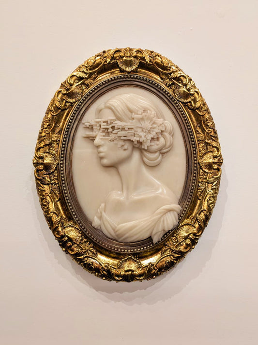 Charlotte Brontë Cameo — resin and 24k gold leaf by JoCa: an ivory cameo profile with curled hair, a glitch band across the eyes, in an ornate gold oval frame